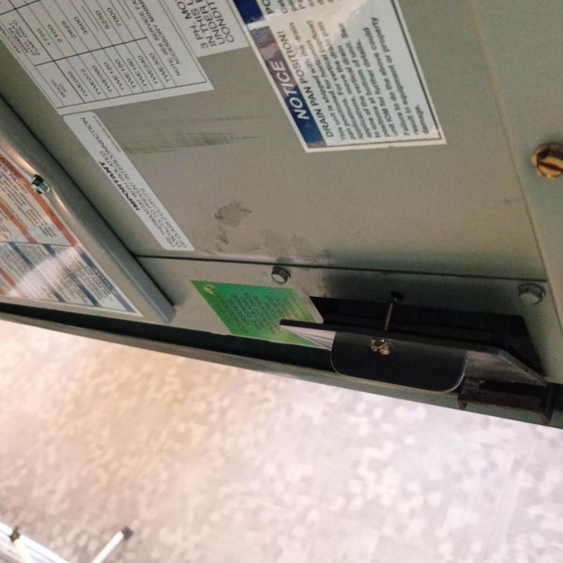 Rooftop unit access panel with warning labels Rooftop unit access panel with warning labels