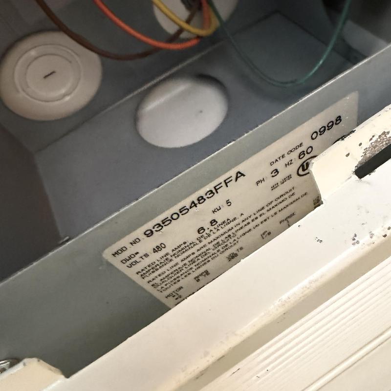 Heater control panel wiring and specification label close-up Heater control panel wiring and specification label close-up