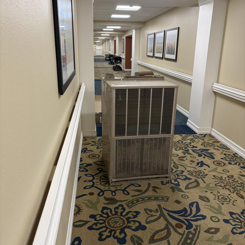 Magic Pack HVAC unit in hallway during installation Magic Pack HVAC unit in hallway during installation
