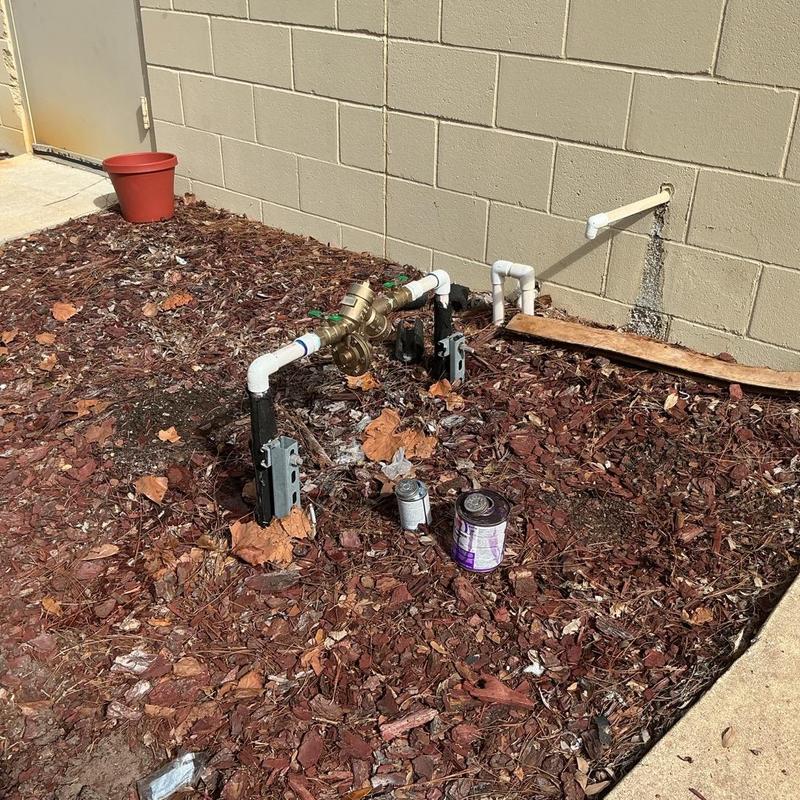 1-inch backflow preventer assembly with piping outdoors