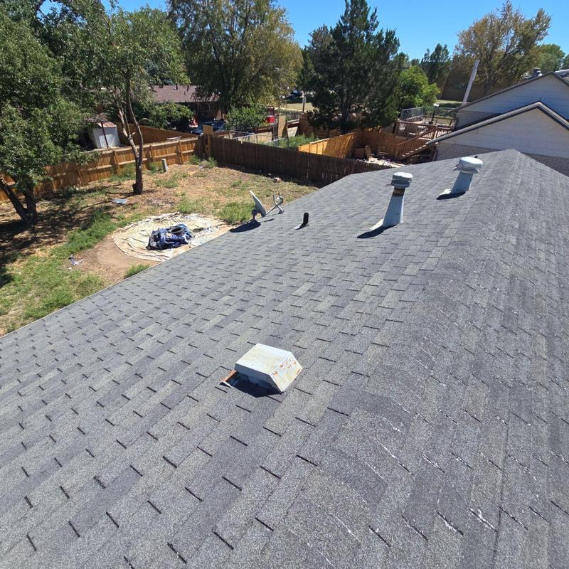 Asphalt shingle roof with multiple vent pipes Asphalt shingle roof with multiple vent pipes