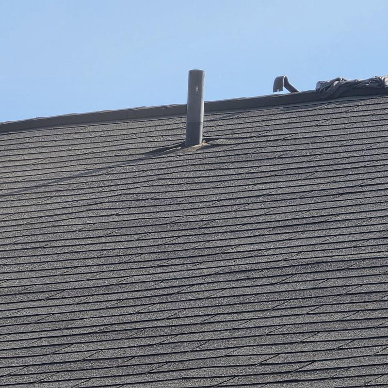 Pipe boot installation on asphalt shingle roof Pipe boot installation on asphalt shingle roof
