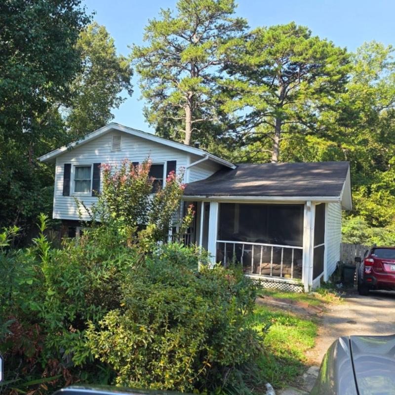 Roof with aging shingles at residential house Roof with aging shingles at residential house