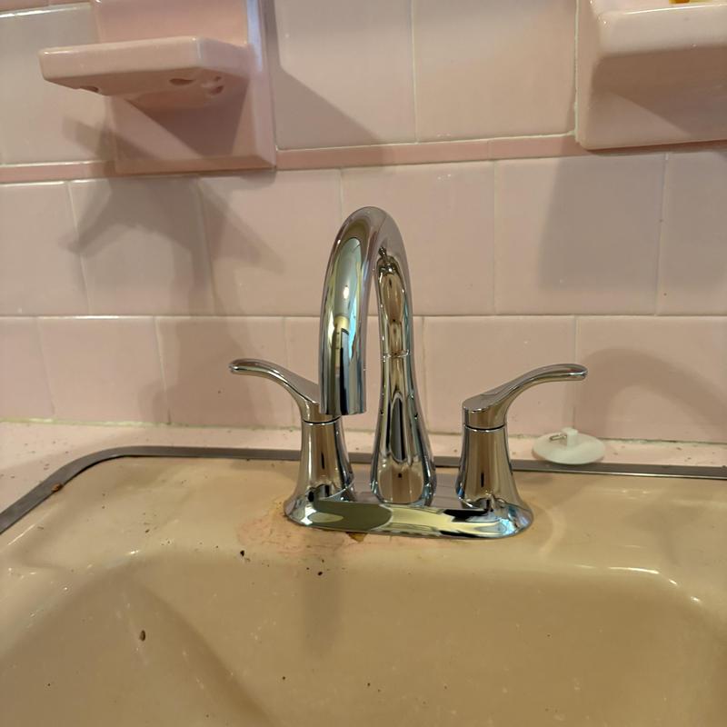 Bathroom faucet with new Kohler installation and sink