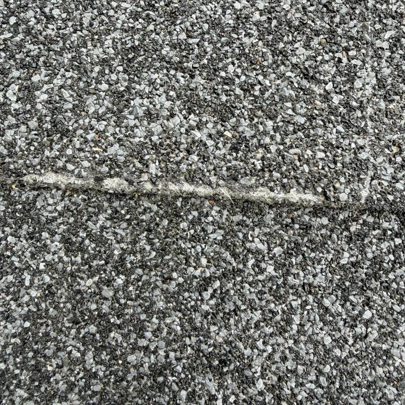 Roofing granule loss on asphalt shingle surface Roofing granule loss on asphalt shingle surface