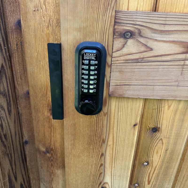 Lockey double-sided keypad lock on wood gate Lockey double-sided keypad lock on wood gate