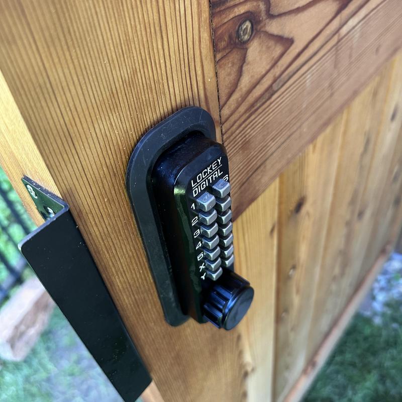 Lockey double-sided keypad lock on wooden gate Lockey double-sided keypad lock on wooden gate