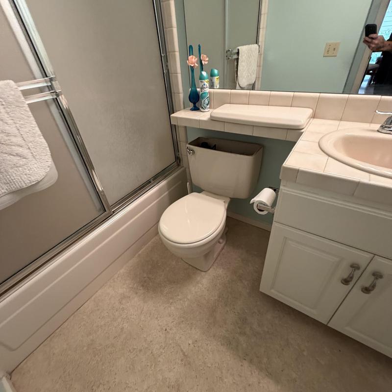 Toilet tank replacement in residential bathroom Toilet tank replacement in residential bathroom