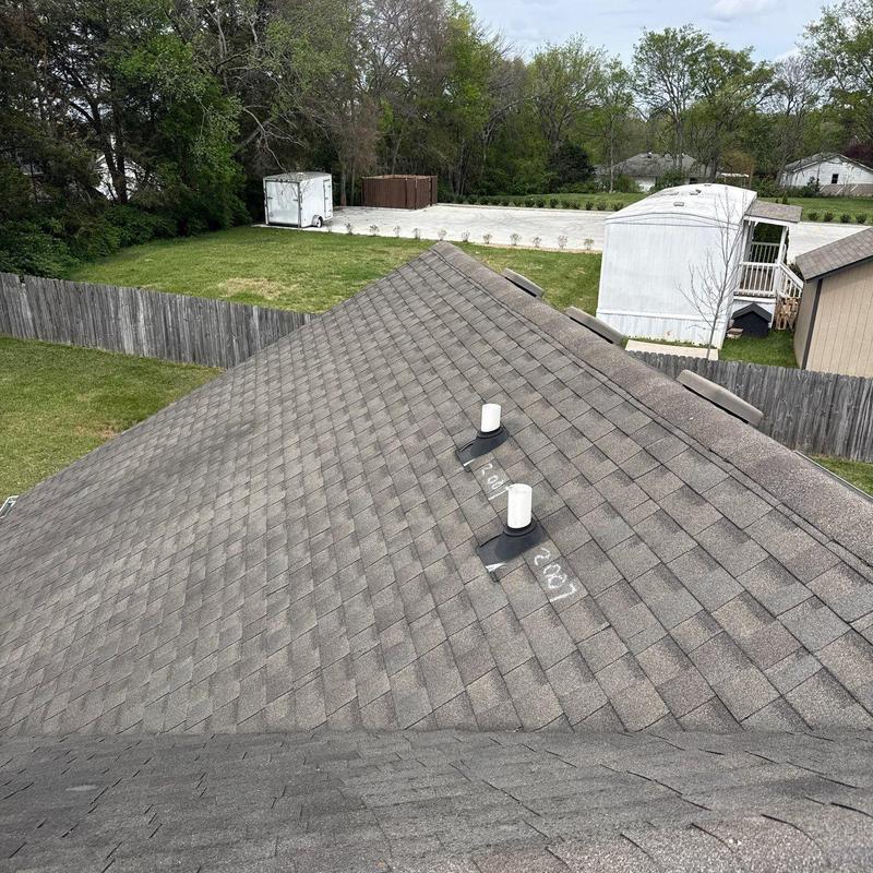 Asphalt shingle roof with hail damage markings