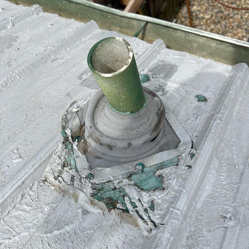 Roof pipe flashing with damaged sealant and rust