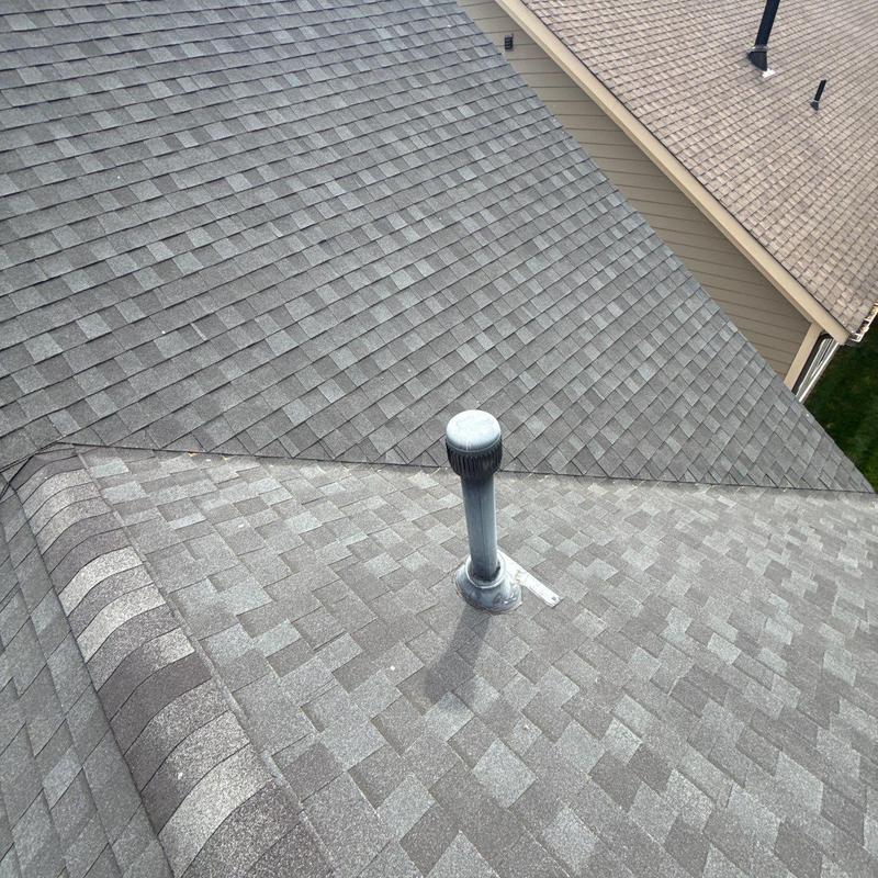 Asphalt shingle roof inspection showing vent pipe detail