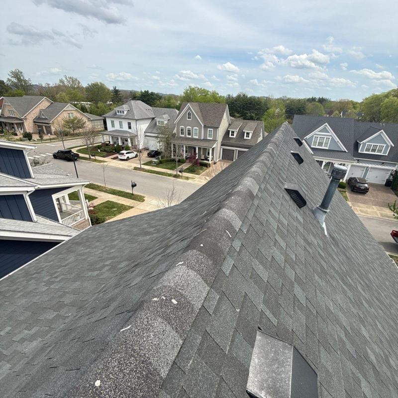 Asphalt shingle roof with hail damage inspection