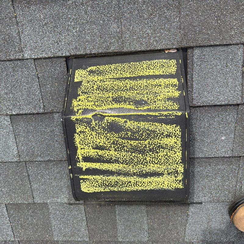 Roof vent with hail damage marked in yellow chalk