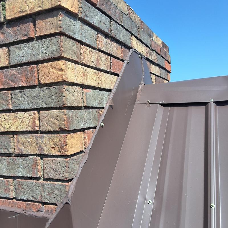 Chimney metal counter flashing on metal roof Chimney metal counter flashing on metal roof
