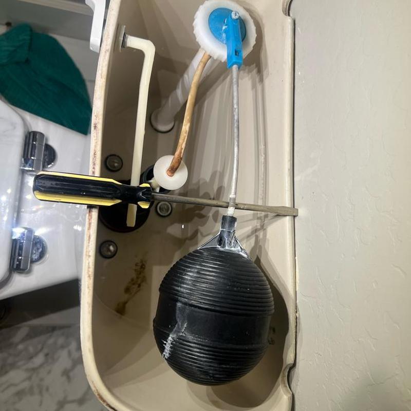 Toilet tank float and lever mechanism adjustment