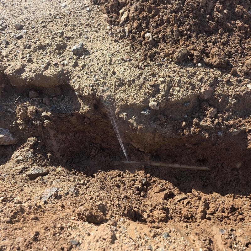One inch water service pipe leak in trench
