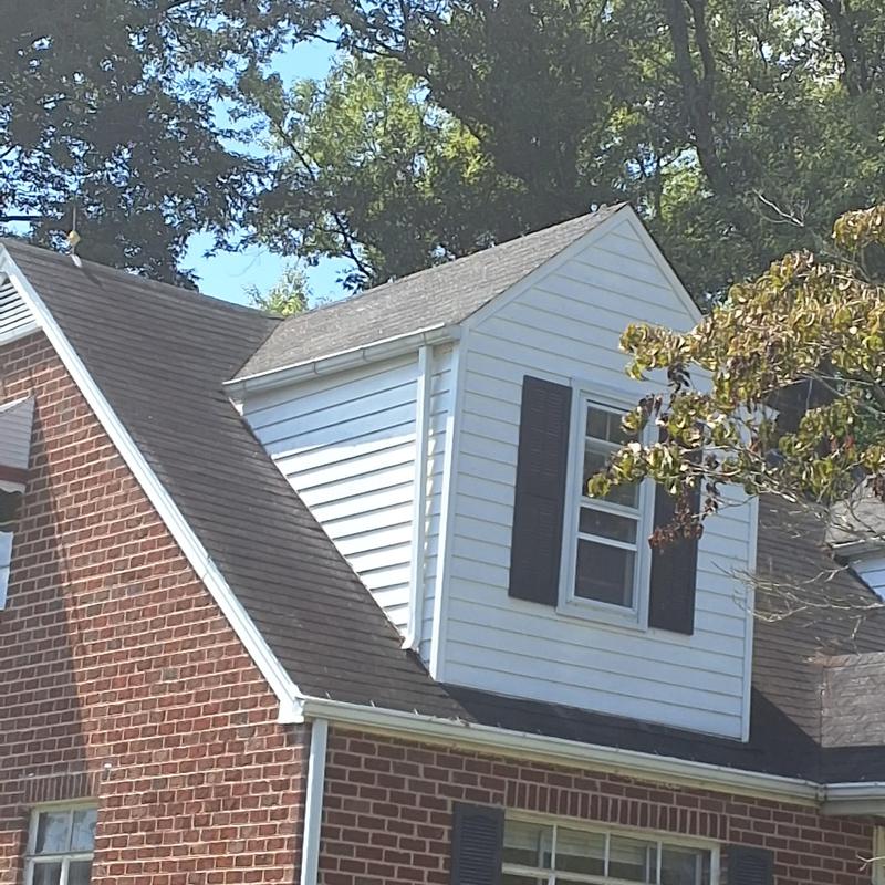 Asphalt shingle roof and dormer siding with window Asphalt shingle roof and dormer siding with window