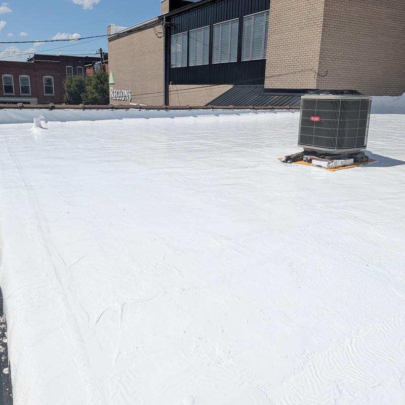 Elastomeric coating on commercial BUR roof with HVAC unit