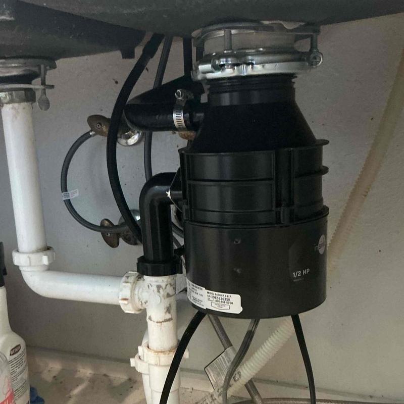 Garbage disposal unit installation under kitchen sink Garbage disposal unit installation under kitchen sink