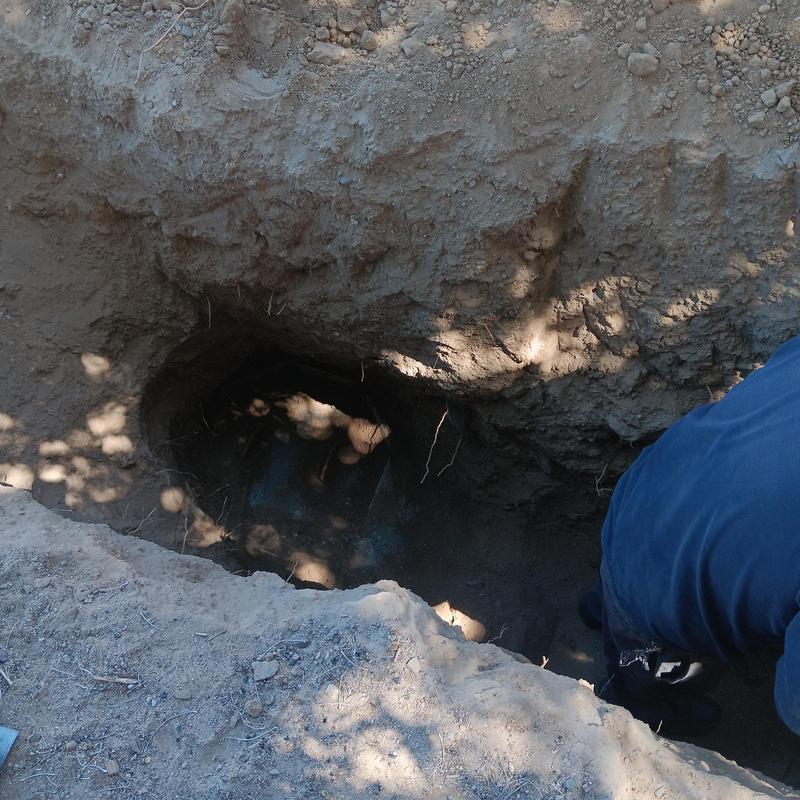Septic tank risers and lids installation in dirt trench Septic tank risers and lids installation in dirt trench