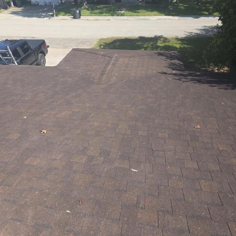 Asphalt shingle roof surface with slight ridge raised