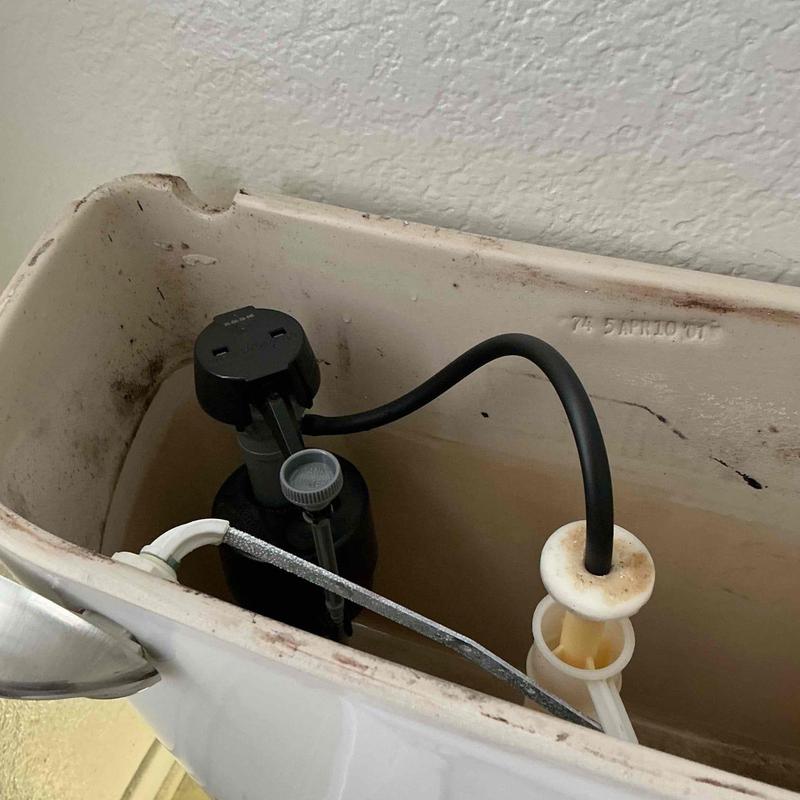 Toilet fill valve and flapper inside tank Toilet fill valve and flapper inside tank