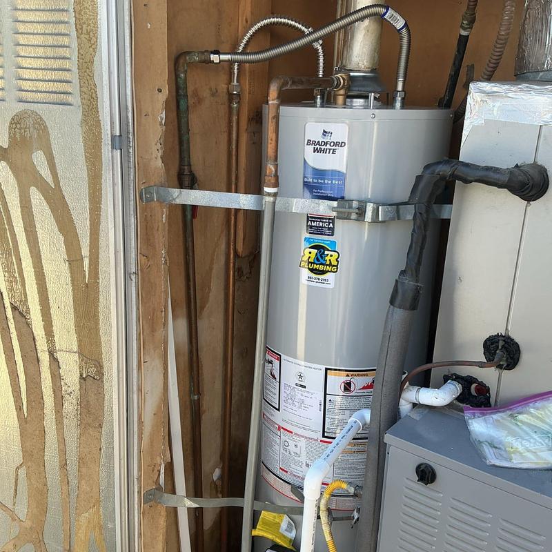 Water heater with new gas line, sediment trap, and catch pan