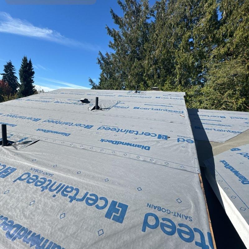 Roof underlayment installation on flat residential roof