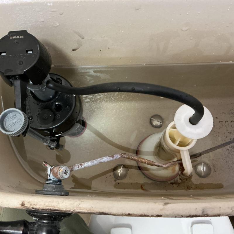 Flush valve and fill valve inside toilet tank Flush valve and fill valve inside toilet tank