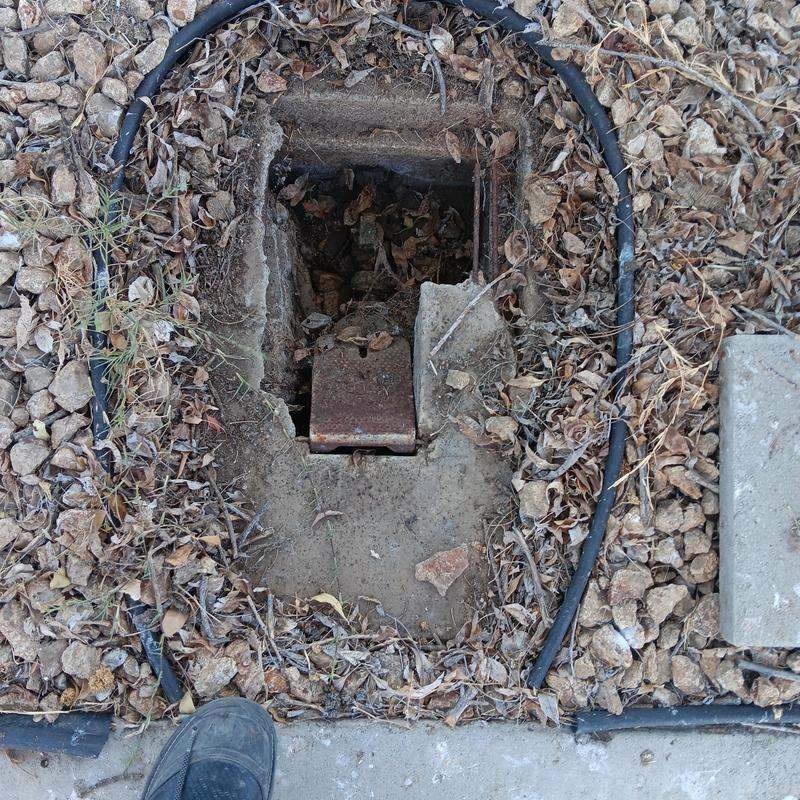 Water meter box with exposed piping and wiring Water meter box with exposed piping and wiring