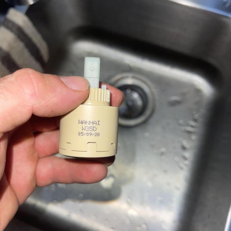 Delta Jakari kitchen faucet cartridge held over sink Delta Jakari kitchen faucet cartridge held over sink