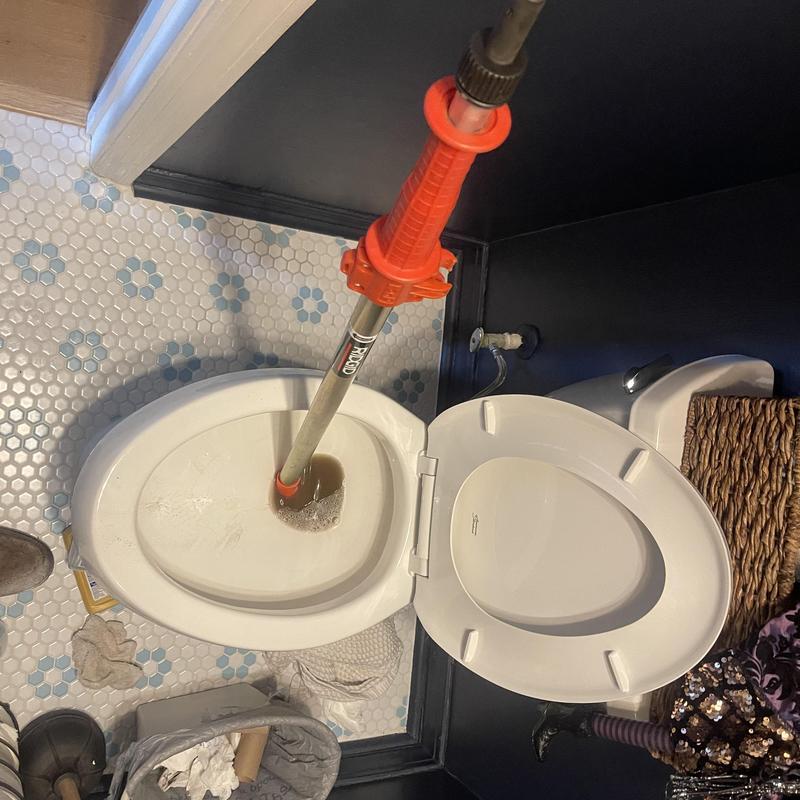 Toilet mainline with drain snake clearing blockage Toilet mainline with drain snake clearing blockage