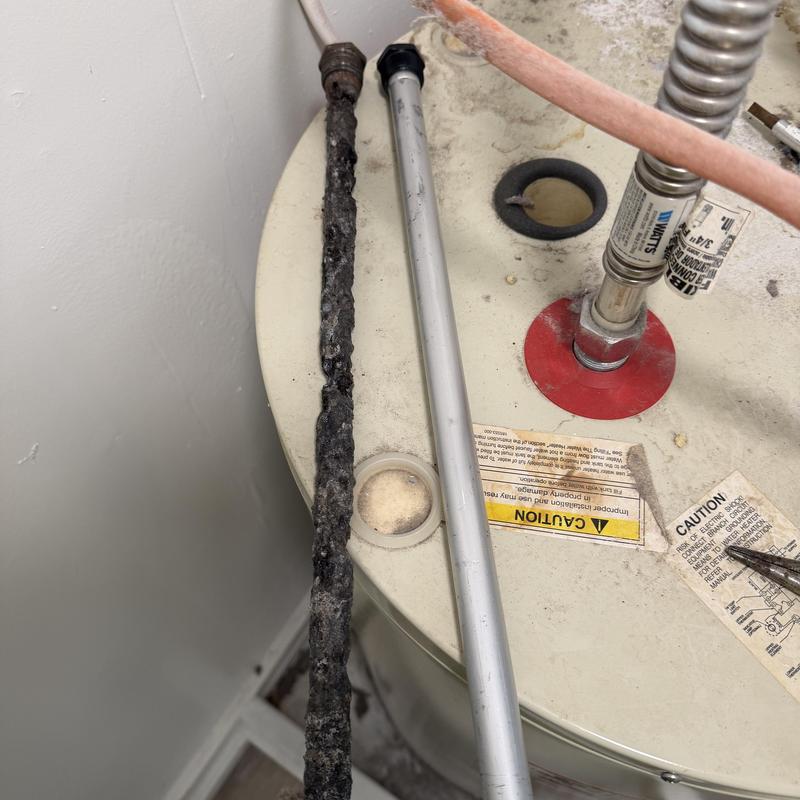 Water heater anode rods showing corrosion and replacement Water heater anode rods showing corrosion and replacement