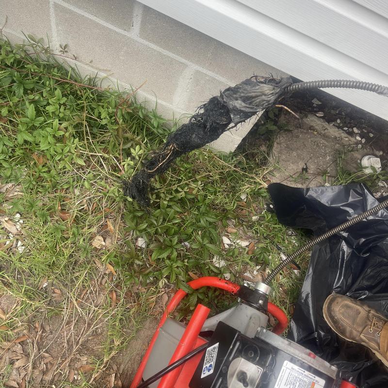 Mainline sewer cable with root clog extraction outdoors Mainline sewer cable with root clog extraction outdoors