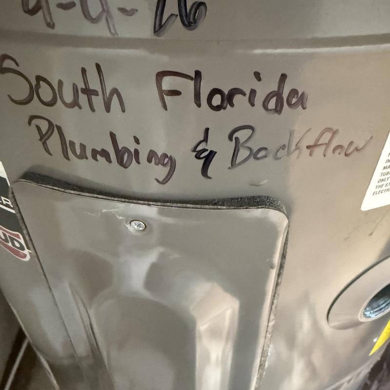 Water heater with South Florida Plumbing label