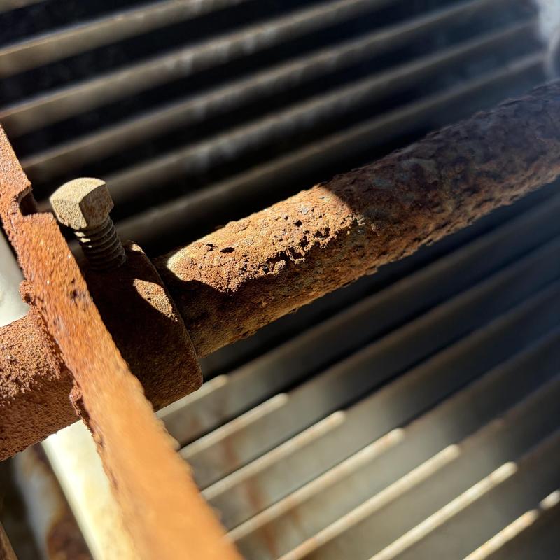 Swamp cooler rusty pipe and metal frame close-up Swamp cooler rusty pipe and metal frame close-up