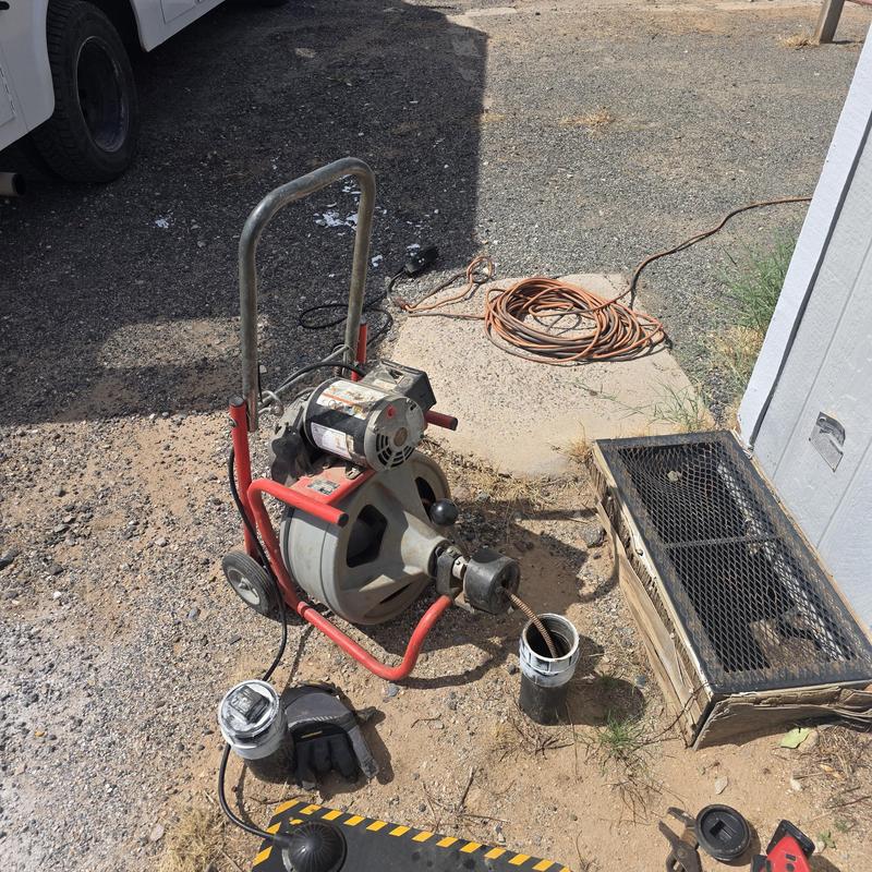 Main sewer line snaking machine with sewer access