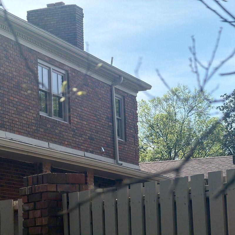 Brick chimney and roof shingles inspection on house
