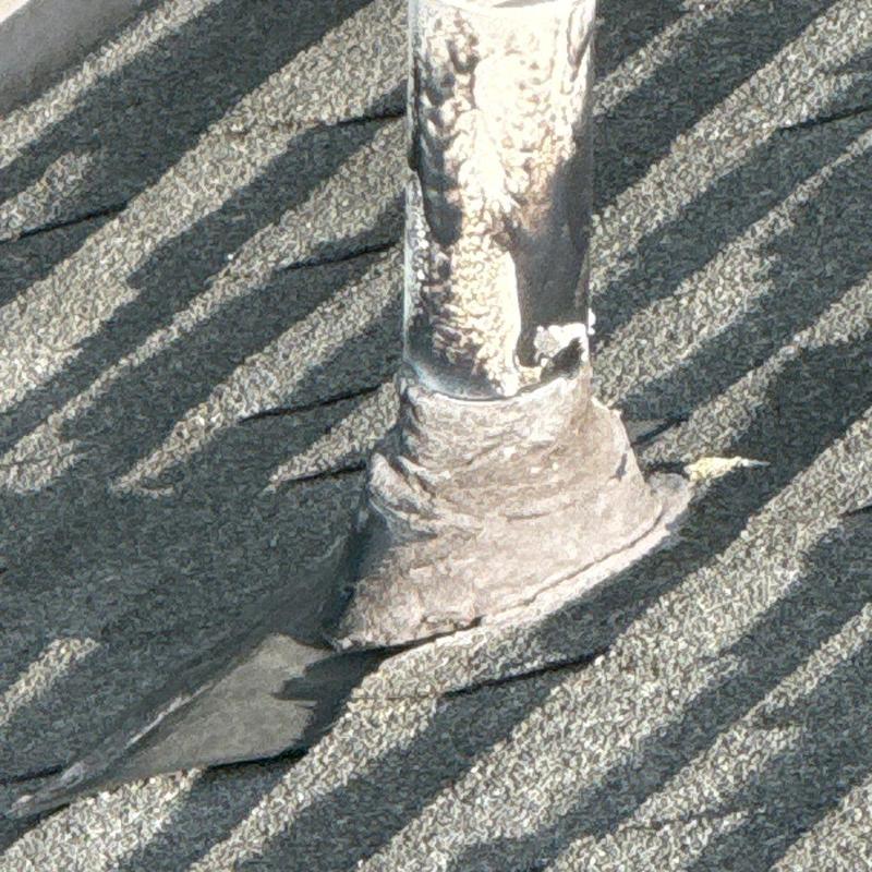 Pipe flashing on roof with hail damage
