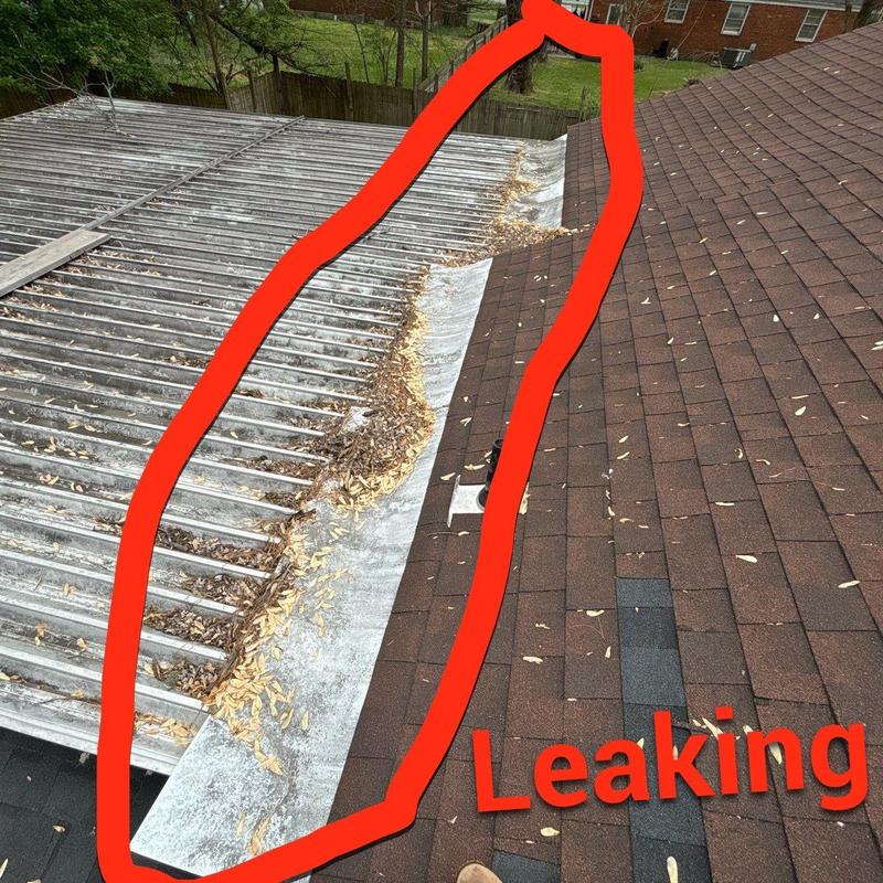 Metal roof valley with debris causing leaking