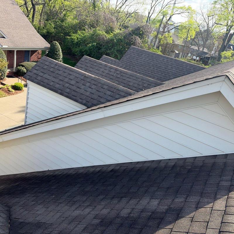 Asphalt shingle roof with hail damage inspection