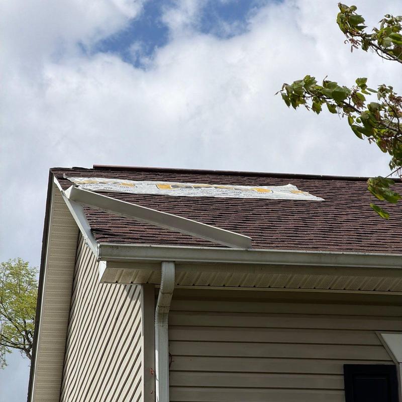 Roof shingles with hail damage and missing underlayment