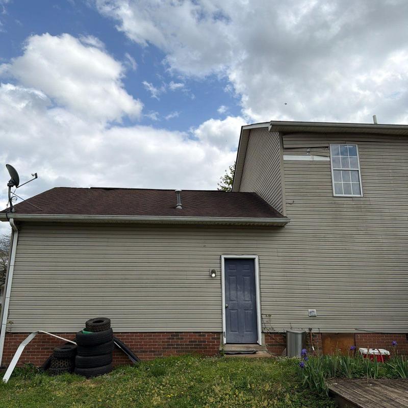 Roof shingles inspection for hail damage on house