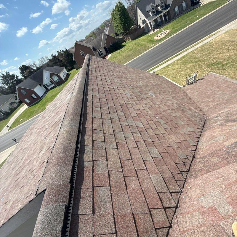 Asphalt shingle roof with ridge vent inspection