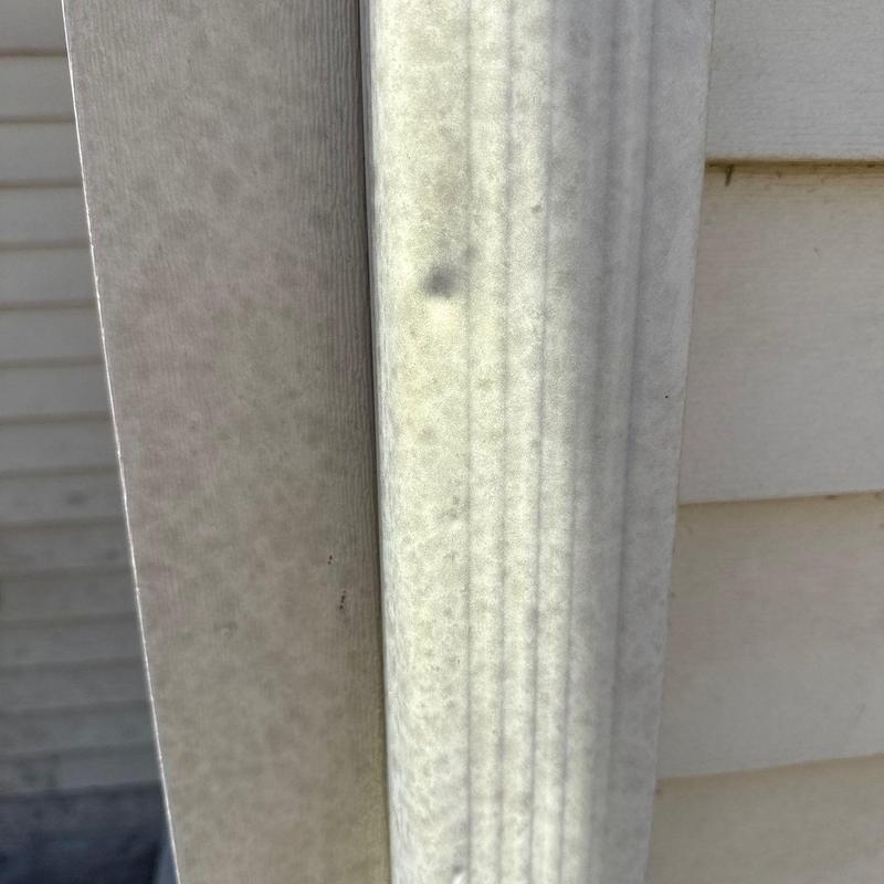 Vinyl siding corner post with minor discoloration