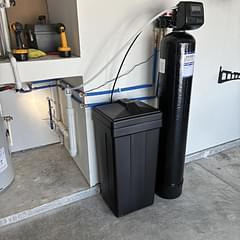 Water softener installation in residential garage Water softener installation in residential garage