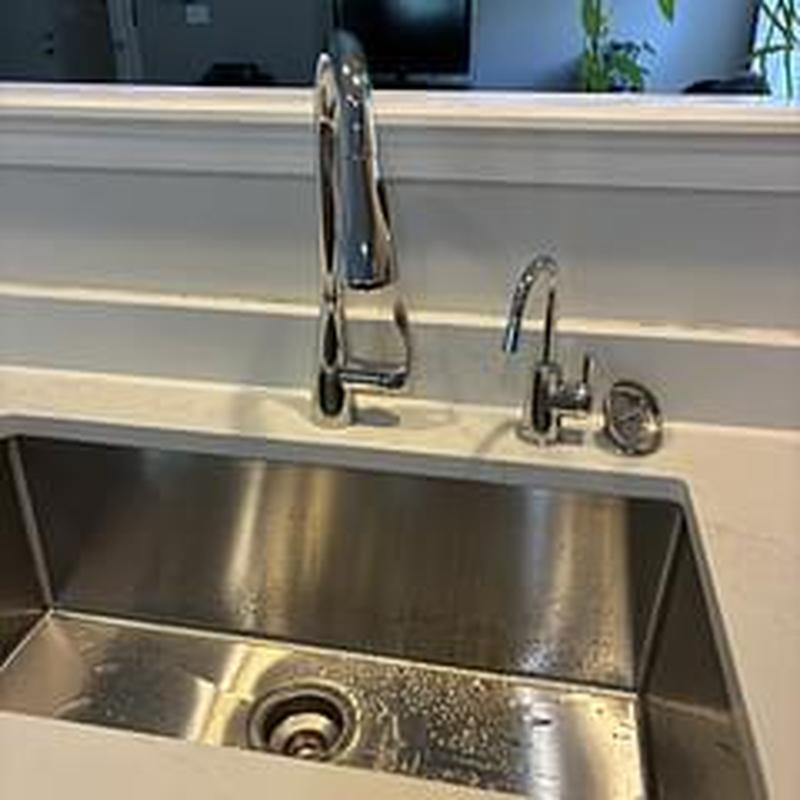 Kitchen faucet and basket strainer installation in sink Kitchen faucet and basket strainer installation in sink