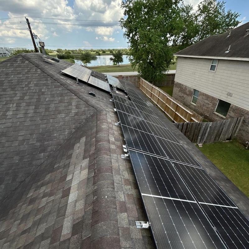 Solar panel array installation on architectural shingle roof