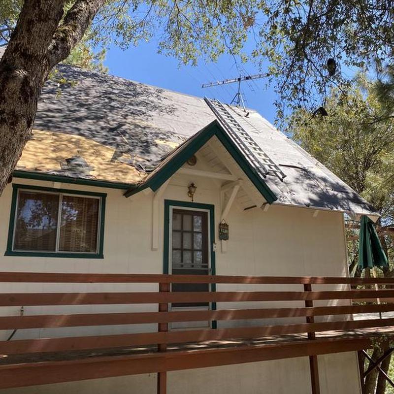 Asphalt roofing underlayment installation with ladder in Tuolumne