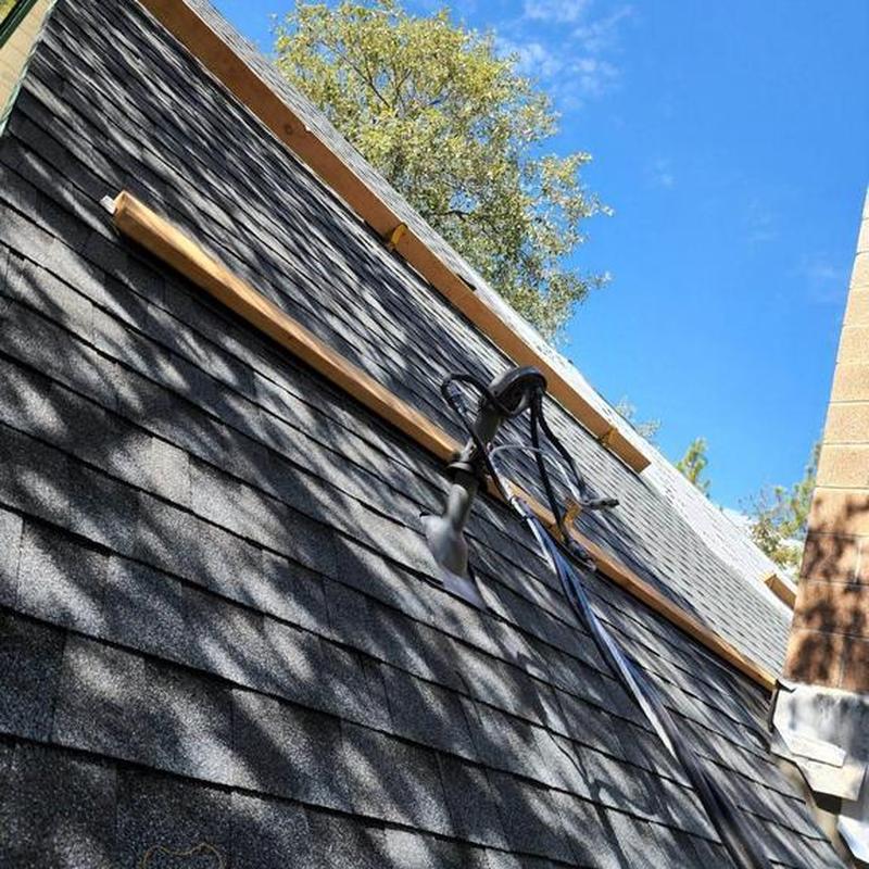 Asphalt shingle roof with safety harness and wood battens